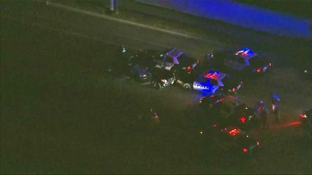 Police respond to a crash near the area of Springdale Street and Bolsa Avenue in Huntington Beach following a police chase Tuesday, Jan. 21, 2014.