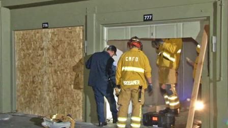 Costa Mesa fire officials inspect the scene of a garage fire near the 2700 block of Mesa Verde Drive East on Monday, Feb. 3, 2014.