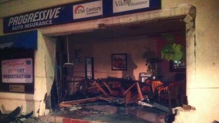 Damage is seen at Progressive Auto Insurance on Thompson Boulevard after a suspected driver slammed into the building on Monday, Aug. 27, 2012.