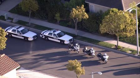 Police vehicles are parked in a neighborhood around Naples Drive and Northport Lane in Oxnard, where two pursuit suspects fled on foot on Thursday, Jan. 3, 2013.