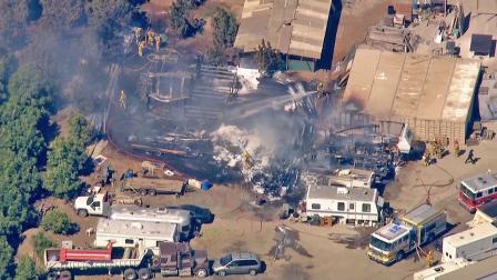 Fire crews are seen at a Santa Paula farm where a fire broke out on Friday, March 1, 2013.