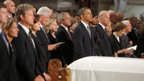 The casket of Senator Edward Kennedy sits between his family, from left, Kara Kennedy Allen, Edward Kennedy Jr., Vicki Reggie Kennedy, former President Bill Clinton, Secretary of State Hillary Clinton, former President George W. Bush and former first lady Laura, President Barack Obama and first lady Michelle Obama, Vice President Joseph Biden and his wife Jill, former first lady Rosalynn Carter and former President Jimmy Carter during the Roman Catholic Funeral Mass for Sen. Edward Kennedy at Our Lady of Perpetual Hope Basilica in Boston, Saturday, Aug., 29, 2009. Kennedy died late Tuesday after a battle with cancer. He was 77.