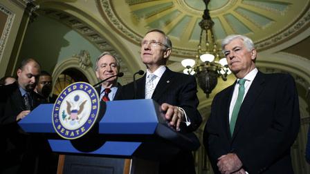 Senate Majority Leader Harry Reid D-Nev., speaks after the U.S. Senate voted to begin debate on health care legislation.