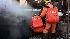 Rescuers search for victims after a gas explosion at the Xinxing mine in Hegang.