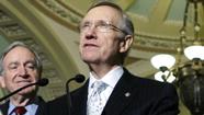 Senate Majority Leader Harry Reid D-Nev., speaks after the U.S. Senate voted to begin debate on health care legislation.
