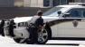 Police block the street in front of the headquarters of the Discovery Channel networks building in Silver Spring, Md., Wednesday Sept. 1, 2010. Police say a gunman has taken at least one person hostage in the building.