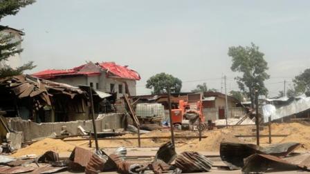 Damaged buildings are seen at a military barracks in the Ouenze neighborhood after multiple explosions occurred at a nearby munitions depot, in Brazzaville, Republic of Congo Sunday, March 4, 2012.