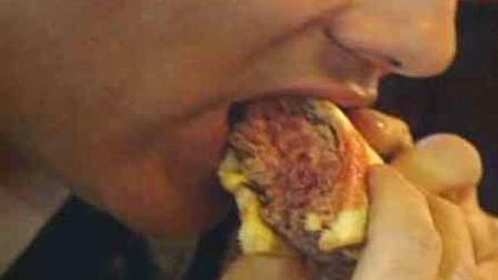 A man bites into a burger in this undated file photo.