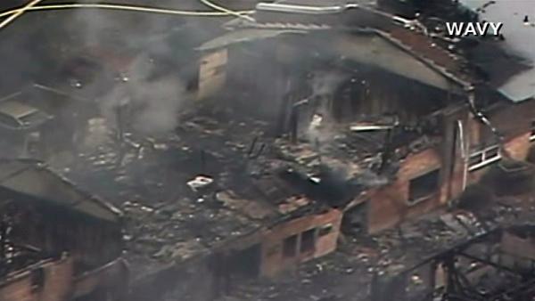 The jet hit the two-story Mayfair Mews apartment complex and erupted in flames.