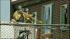 An official is seen breaking the window of James...