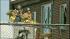 An official is seen breaking the window of James...