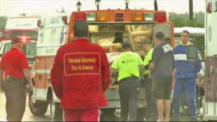 A man is seen being loaded into an ambulance after a lightning strike at a NASCAR event in Long Pond, Pa., on Sunday, August 5, 2012. A 41-year-old man died in the lightning strike.
