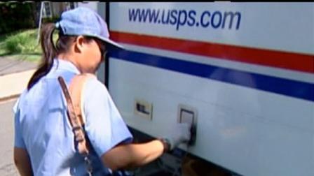 A USPS worker is seen in this undated file photo.