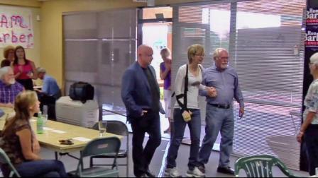 Gabby Giffords (center) is seen walking beside her husband, retired astronaut Mark Kelly (left), in this undated file photo.