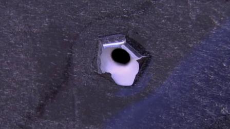 A bullet hole is shown on a car door following a shooting near Interstate 96 in Michigan.