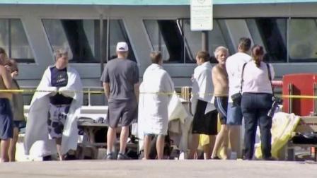 A group of passengers is seen after they were rescued from a capsized boat off the coast of Florida on Thursday, Nov. 23, 2012.