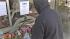 World visitors arrive to honor Newtown :: A man is seen placing flowers at a memorial for the Sandy Hook shooting victims.