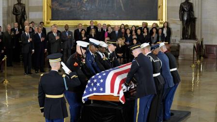A joint military honor guard carries in the casket of Sen. Daniel Inouye, D-Hawaii, the second-longest-serving senator in history, to lie in state in the Capitol Rotunda in Washington, Thursday, Dec. 20, 2012.