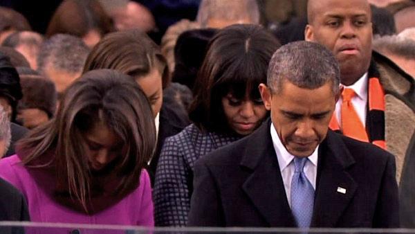President Barack Obama bows his head during the benediction at the ceremonial swearing-in on the West Front of the U.S. Capitol during the 57th Presidential Inauguration in Washington, Monday, Jan. 21, 2013.