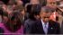 President Barack Obama bows his head during the...