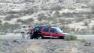 Authorities surround the SUV of former Nevada Assemblyman Steven Brooks after a pursuit on Thursday, March 28, 2013.