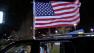 Bostonians wave an American flag in celebration of the second Boston Marathon bombing suspects capture Friday, April 19, 2013.