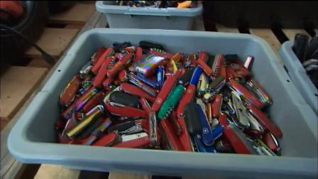 Small knives are seen in a bin in this undated file photo.