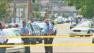 Police are seen at the site of a shooting in New Orleans. Gunfire broke out during a Mothers Day parade Sunday, May 12, 2013. At least 17 people were wounded.