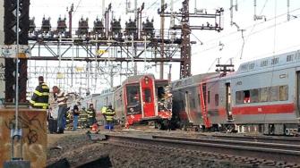 
Emergency workers arrive the scene of a Metro North train collision, May 17, 2013 in Fairfield, Conn.