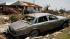 A car, house and other debris sit damaged in Granbury, Texas, on Friday May 17, 2013.