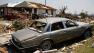 A car, house and other debris sit damaged in Granbury, Texas, on Friday May 17, 2013.