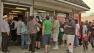 People lined up Saturday at Blue Bird Liquor in Hawthorne to buy Powerball tickets.