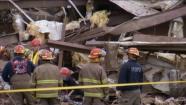 Rescue crews look at the damage area after a deadly tornado hit Moore, Okla., Monday, May 20, 2013.