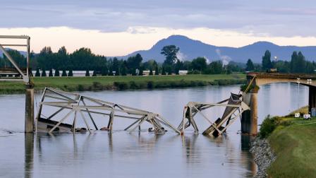 A collapsed portion of the Interstate 5 bridge lies in the Skagit River Friday, May 24, 2013, in Mount Vernon, Wash.