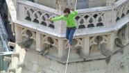 A man makes the first tightrope walk between the two towers of St. Stephens Cathedral in Austria.
