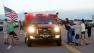Supporters greet fire crews as they return from their shifts from fighting the Black Forest wildfire outside a fire camp at Pine Creek High School in Colorado Springs, Colo., Sunday, June 16, 2013.