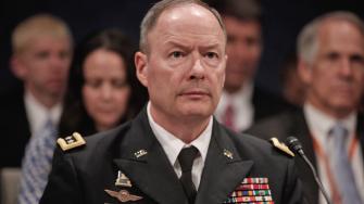 Gen. Keith B. Alexander, director of the National Security Agency approaches the witness table to testify before the House Permanent Select Committee on Intelligence regarding NSA surveillance in Washington, Tuesday, June 18, 2013.