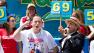 Joey Chestnut, foreground left, wins the Nathans Famous Fourth of July International Hot Dog Eating contest with a total of 69 hot dogs and buns at Coney Island, Thursday, July 4, 2013, in the Brooklyn borough of New York.