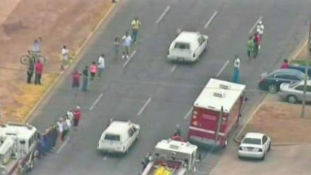 A caravan of hearses carrying the bodies of 19 firefighters killed in the Yarnell, Ariz., wildfire travels through Arizona as people stop to pay their respects Sunday, July 7, 2013.