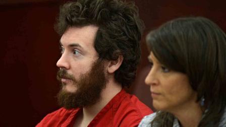 In this March 12, 2013 file photo, James Holmes, left, and defense attorney Tamara Brady appear in district court in Centennial, Colo. for his arraignment.