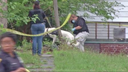 Authorities investigate a home in Cleveland where three bodies were found Friday, July 19, 2013 and Saturday, July 20, 2013.