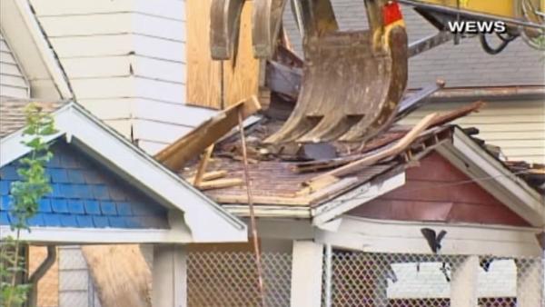 Ariel Castro's Cleveland house is torn down Wednesday, Aug. 7, 2013. Gina DeJesus, Michelle Knight and Amanda Berry were held captive and raped at the house for over a decade before escaping May 6.