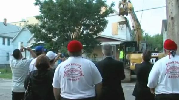 Ariel Castro's Cleveland house is torn down Wednesday, Aug. 7, 2013. Gina DeJesus, Michelle Knight and Amanda Berry were held captive and raped at the house for over a decade before escaping May 6.