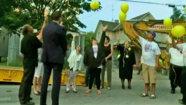 Balloons are released before Ariel Castro's house is torn down Wednesday, Aug. 7, 2013.
