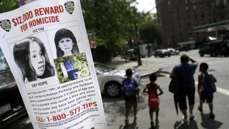 This Tuesday, July 23, 2013, photo shows a poster soliciting information regarding an unidentified body near the site where the body was found in New York.