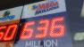 A Mega Millions jackpot sign is seen at a Highland Park store on Tuesday, Dec. 17, 2013.