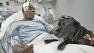 Cecil Williams, 61, and his guide dog Orlando are shown in a hospital after they had a close call with a New York subway train.