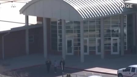 Authorities investigate a shooting at a middle school in Roswell, New Mexico, on Tuesday, Jan. 14, 2014.