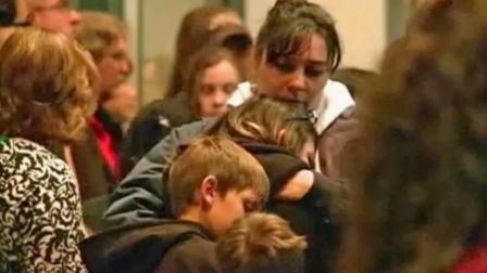 Parents and students gather at a vigil for victims of a shooting at a middle school in Roswell, N.M., on Tuesday, Jan. 14, 2014.