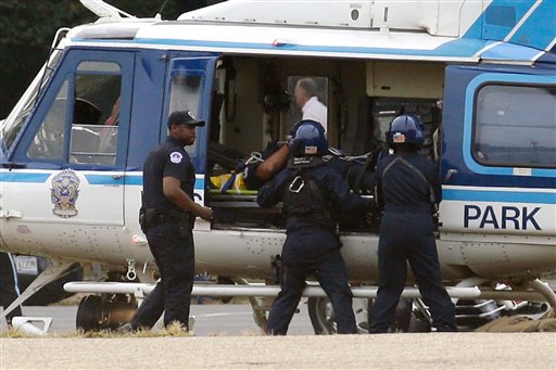 A U.S. Park Police helicopter is loaded on the...